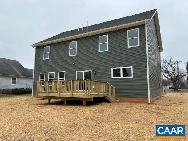 back of house with a wooden deck