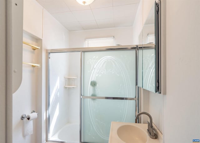 full bath with bath / shower combo with glass door and a sink