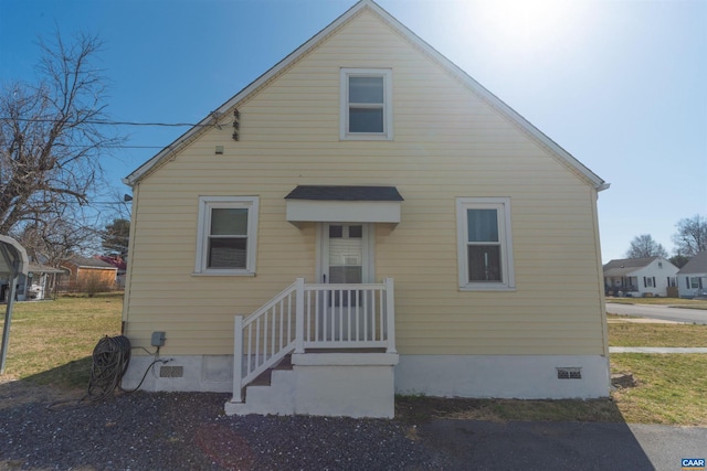 bungalow-style home featuring crawl space and a front lawn