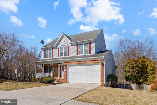 traditional-style home with brick siding, a porch, concrete driveway, and fence