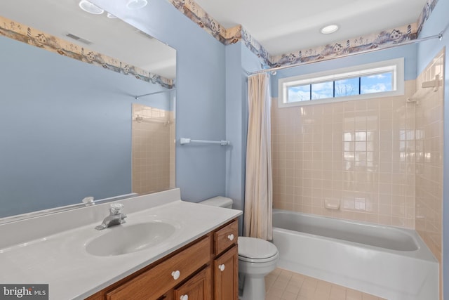 full bath featuring tile patterned floors, visible vents, toilet, shower / bath combination with curtain, and vanity