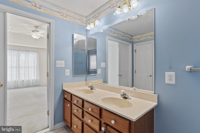 bathroom with a sink, ceiling fan, and double vanity