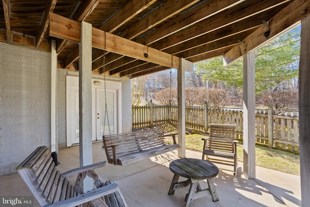 view of patio / terrace featuring fence