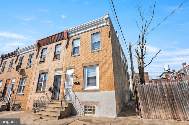 multi unit property with brick siding and fence