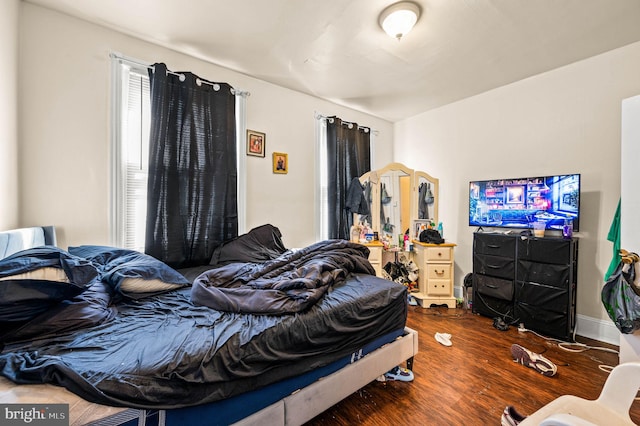 bedroom with wood finished floors