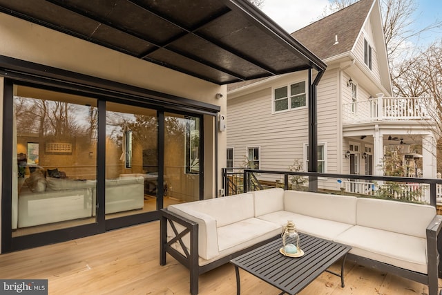 wooden terrace featuring an outdoor hangout area