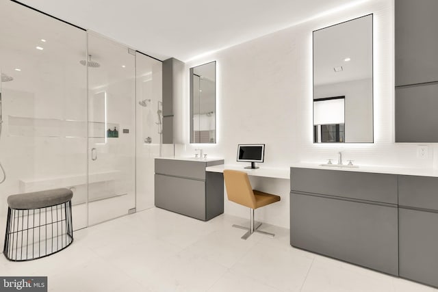 full bath with a shower stall, two vanities, tasteful backsplash, and a sink