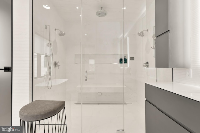 bathroom with vanity and a shower stall