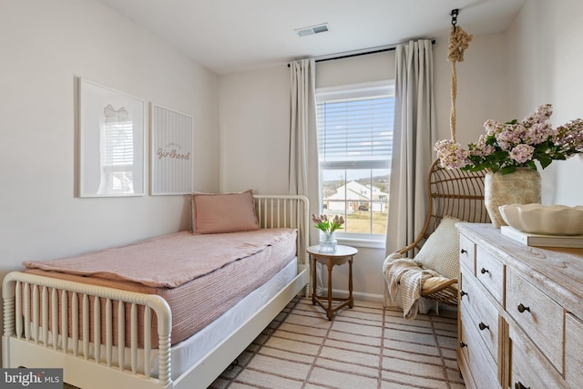 bedroom featuring visible vents