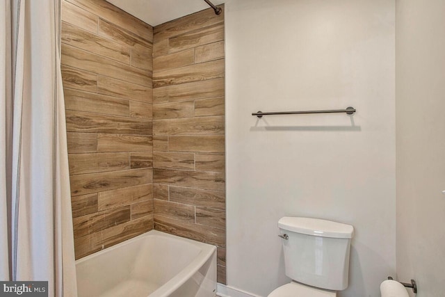 bathroom with toilet and shower / bathtub combination