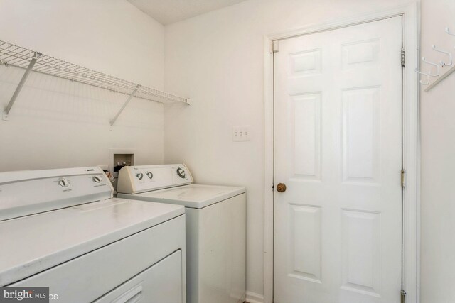 laundry room featuring laundry area and washing machine and clothes dryer