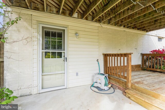 property entrance with a deck