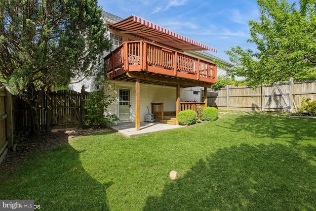 back of property featuring a deck, a gate, a fenced backyard, a yard, and a patio