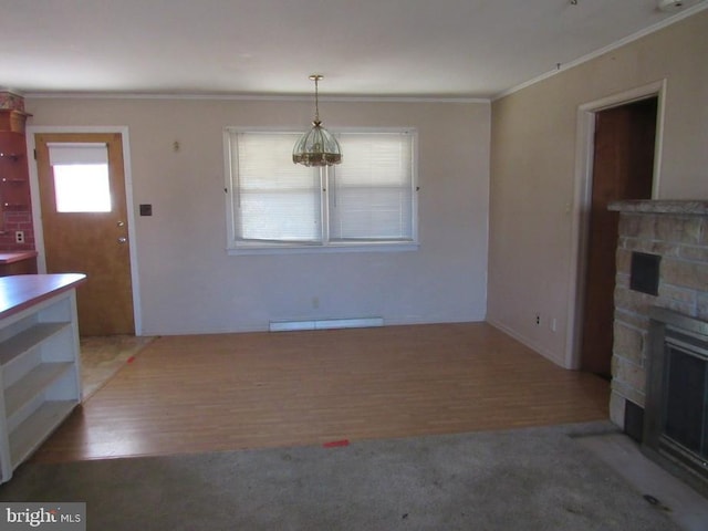 unfurnished living room with ornamental molding, a fireplace, wood finished floors, and a baseboard radiator