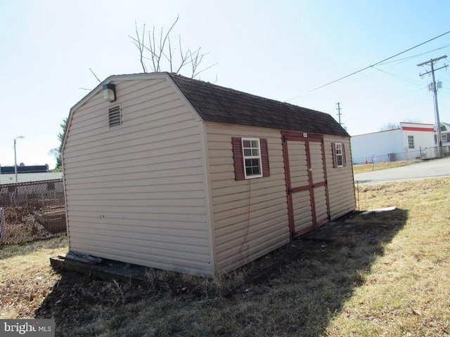 view of shed with fence