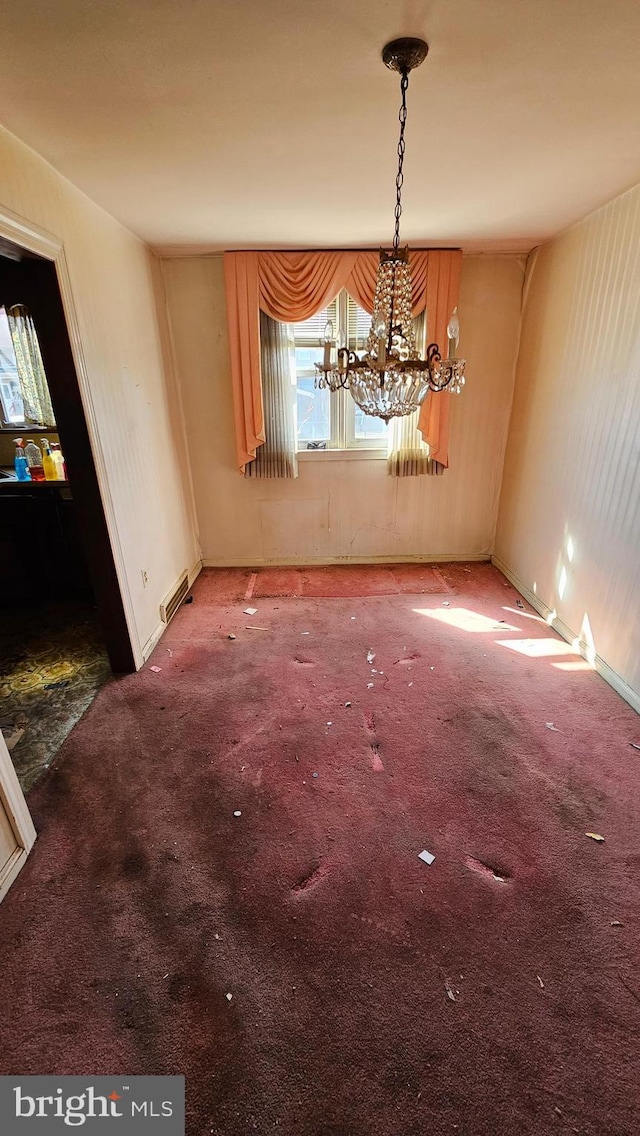 unfurnished dining area with a notable chandelier, visible vents, and carpet floors