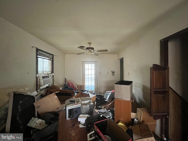 interior space featuring cooling unit and a ceiling fan