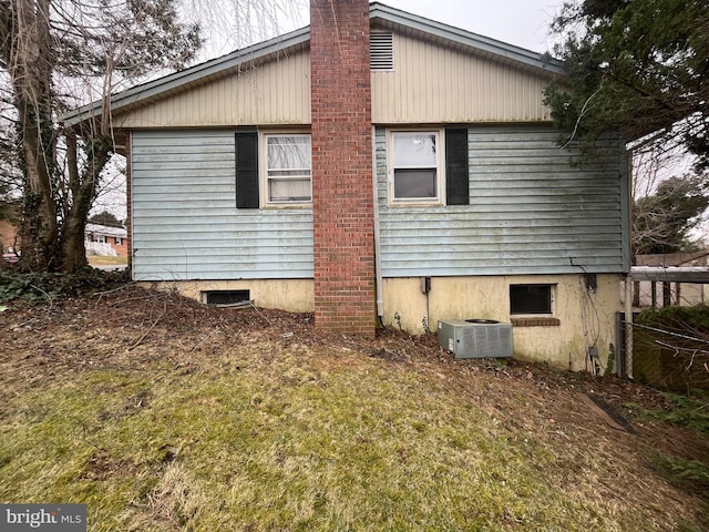 view of side of property featuring cooling unit