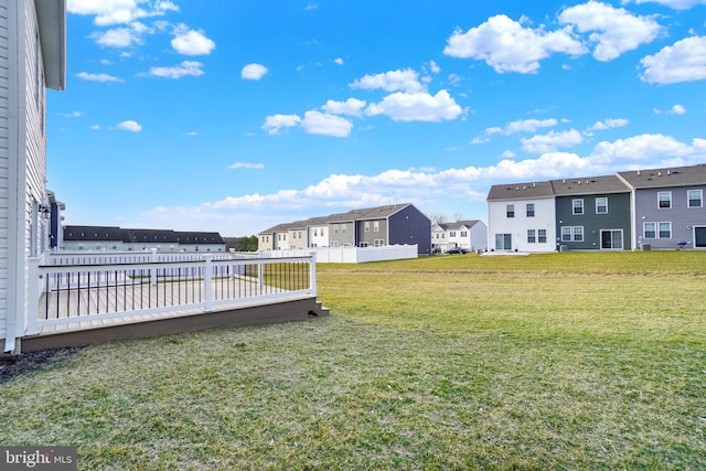 view of yard with a residential view and fence