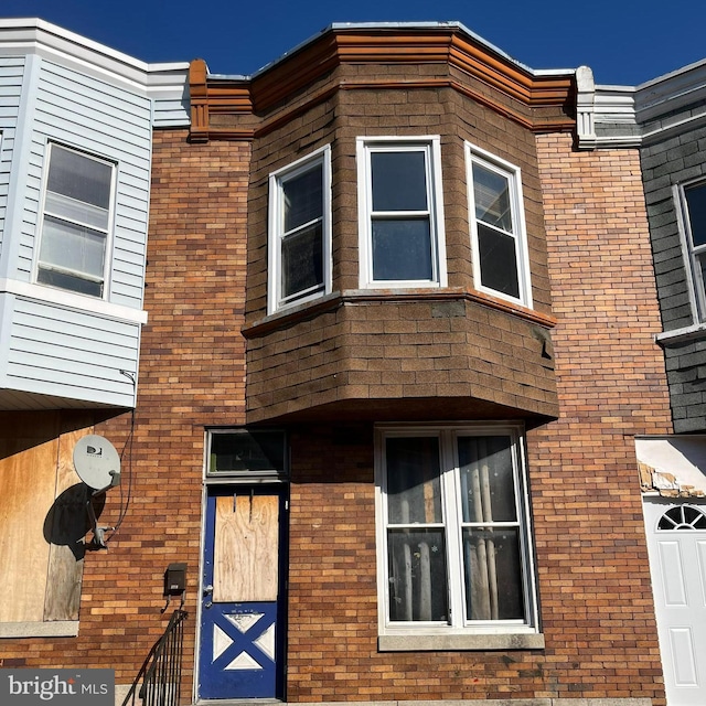 exterior space with brick siding