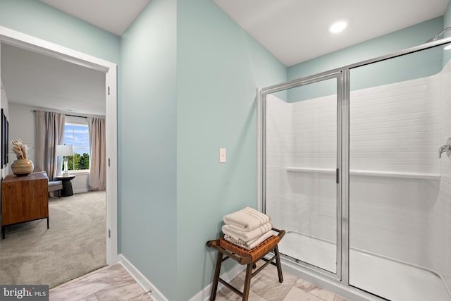 full bathroom featuring recessed lighting, baseboards, and a stall shower