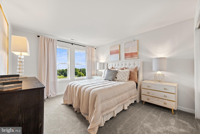 bedroom with visible vents, baseboards, and carpet