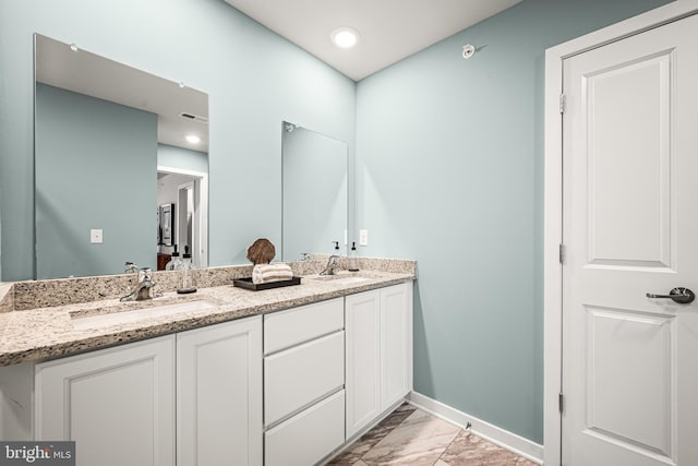 full bathroom featuring double vanity, visible vents, marble finish floor, and a sink