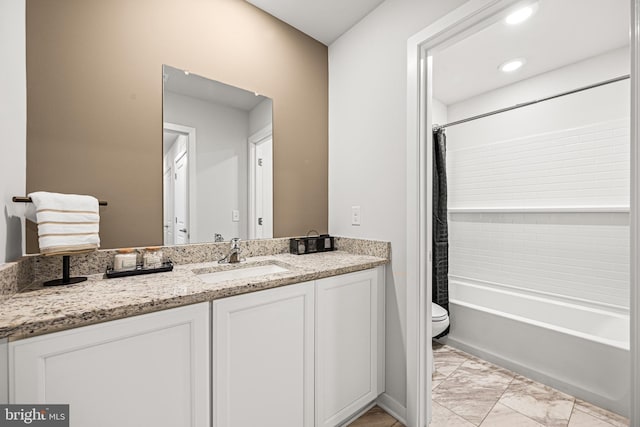 full bath with toilet, recessed lighting, shower / tub combo, marble finish floor, and vanity