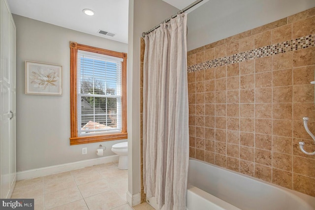 full bathroom featuring visible vents, baseboards, tile patterned flooring, shower / bath combination with curtain, and toilet