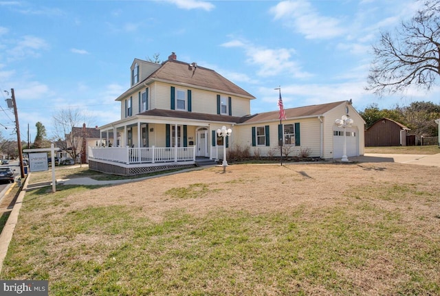 view of front facade featuring covered porch, an attached garage, concrete driveway, and a front lawn