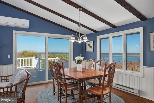 dining space featuring wood finished floors, lofted ceiling with beams, a wall mounted air conditioner, wainscoting, and a notable chandelier