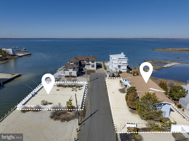 bird's eye view featuring a residential view and a water view