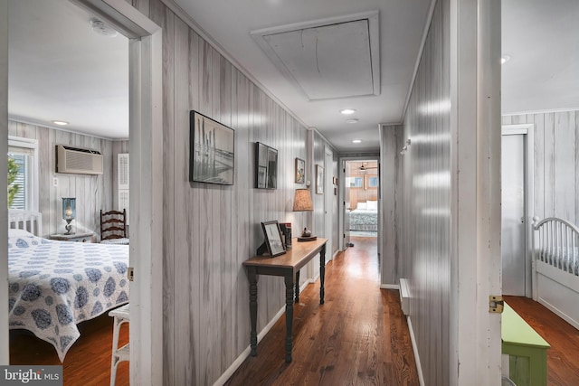 hall featuring dark wood finished floors, recessed lighting, attic access, and a wall unit AC