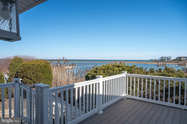 wooden terrace with a water view