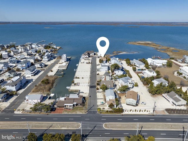 bird's eye view featuring a residential view and a water view