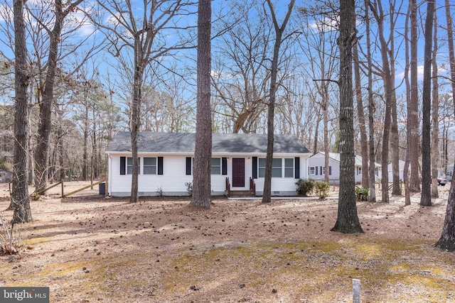 view of front of home with roof with shingles and crawl space