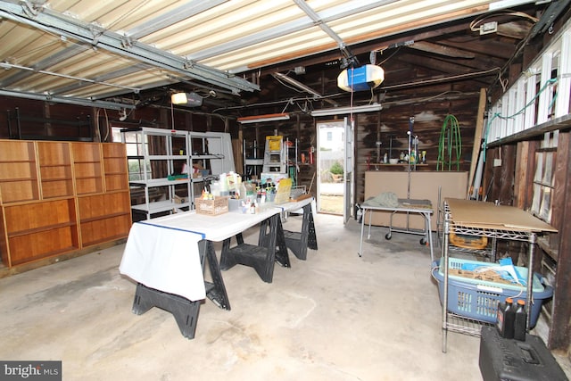 garage featuring a workshop area and a garage door opener