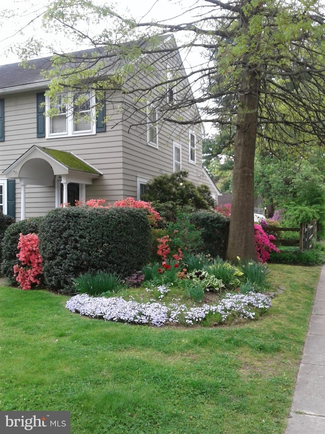 view of home's exterior featuring a yard