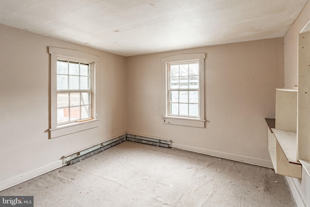 unfurnished room with baseboards