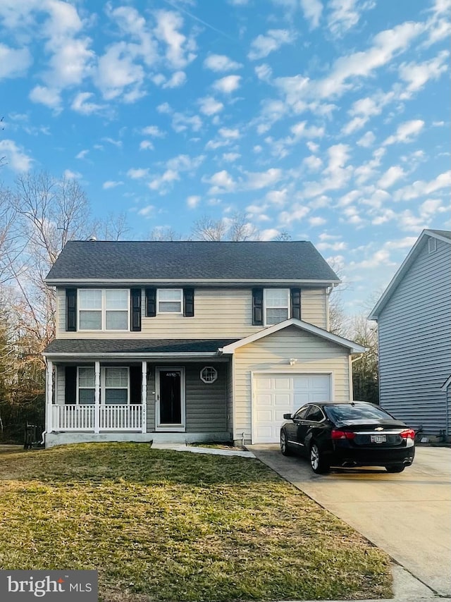 traditional-style home featuring a garage, a porch, concrete driveway, and a front lawn