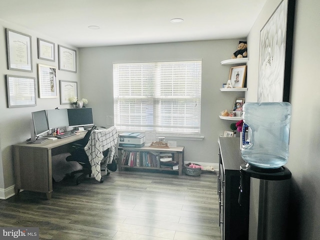 home office featuring wood finished floors and baseboards