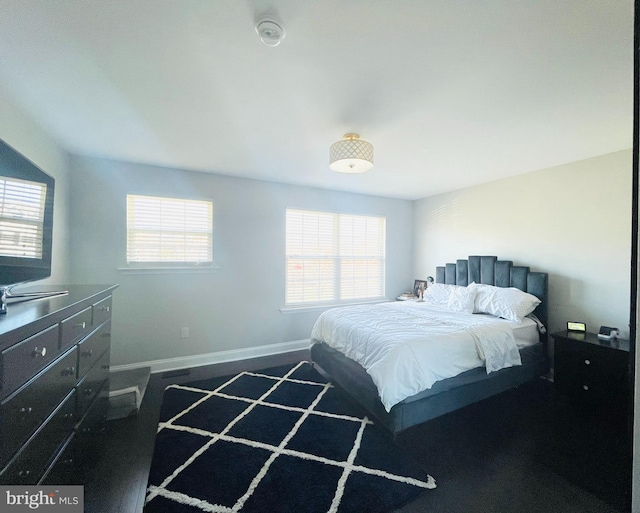 bedroom featuring baseboards