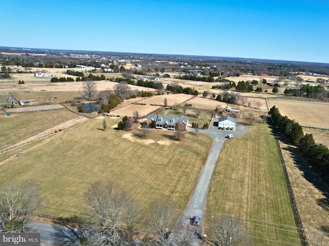 birds eye view of property with a rural view