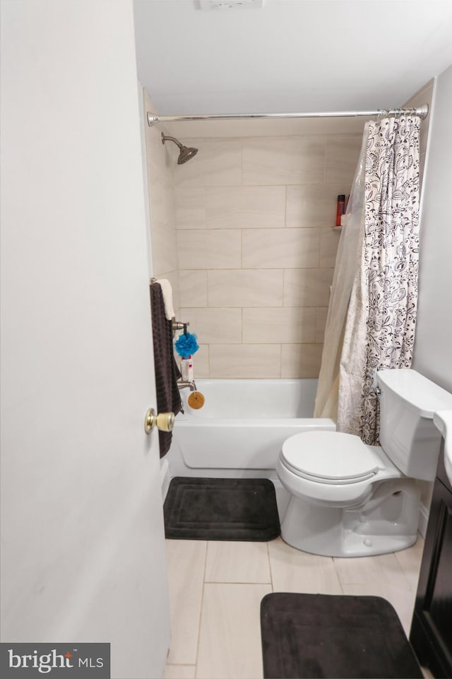 bathroom with toilet and shower / bathtub combination with curtain