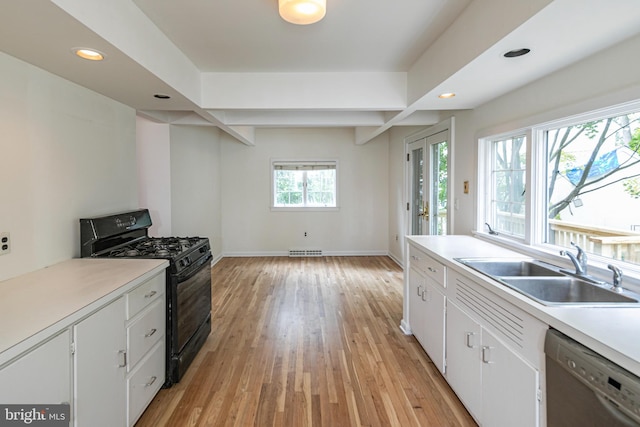 kitchen with dishwashing machine, light wood finished floors, recessed lighting, a sink, and black range with gas stovetop