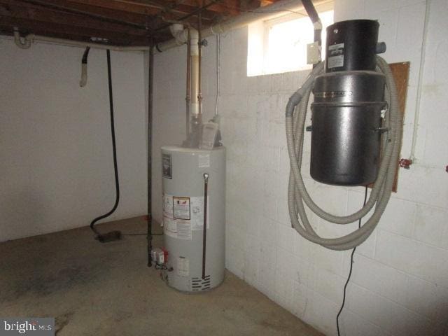 utility room with water heater