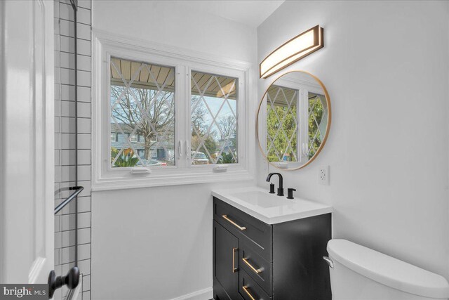 bathroom with vanity and toilet