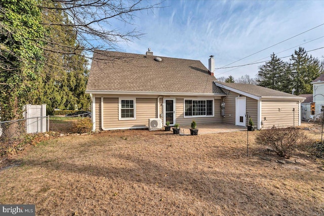 back of property featuring fence, roof with shingles, ac unit, a chimney, and a patio