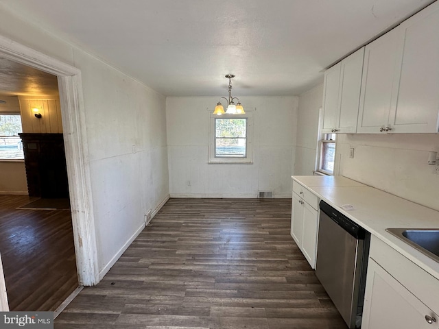 kitchen featuring dishwasher, a healthy amount of sunlight, dark wood-style flooring, and white cabinetry