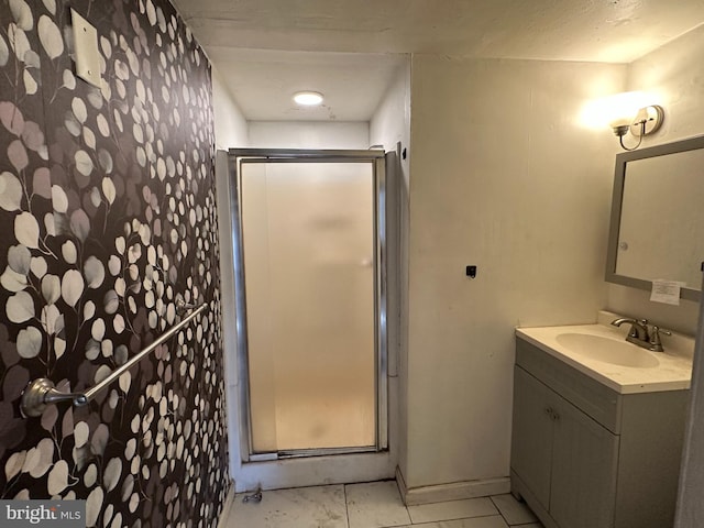 bathroom featuring a stall shower and vanity